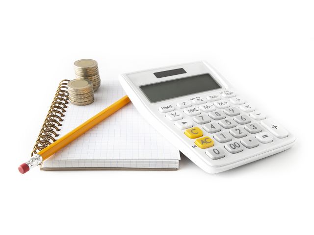 Calculator and pen on a wire bound notebook
