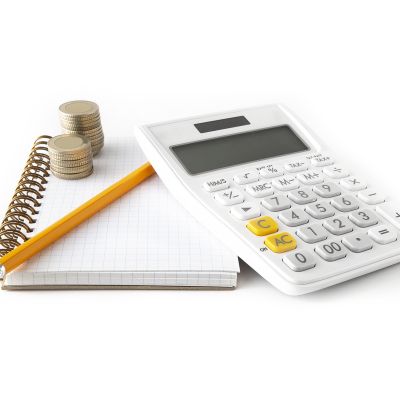 Calculator and pen on a wire bound notebook